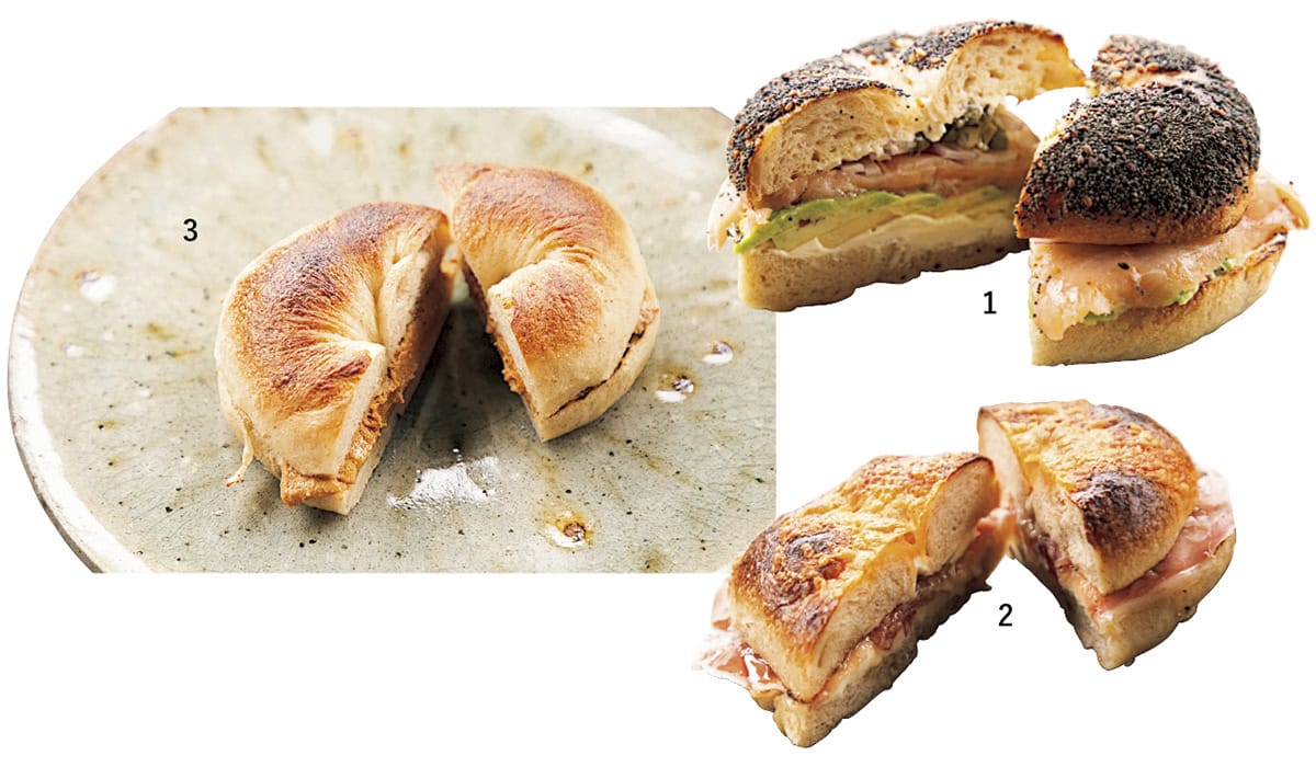 人気のベーグルサンドは、店頭で焼きたてを頰張りたい。ゴマ、ポピーシードなどをトッピングしたエブリシング、チーズ、プレーンの3種から好みのベーグルを選べる。1.ボリューミーなスモークサーモン&アボカドサンド ¥1,100。 2.意外な組み合わせにハマる生ハム&ハニー ¥990。 3.ザクザクと歯応えのある手作りのピーナッツバターサンド¥650。